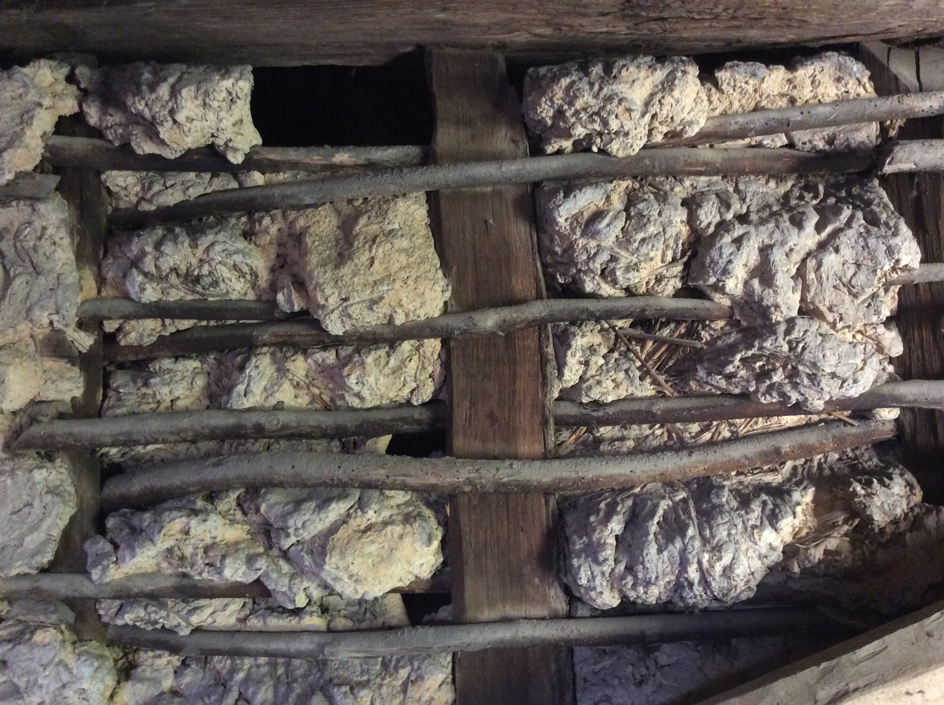 Original wattle-and-daub infill panel between hand-hewn timbers