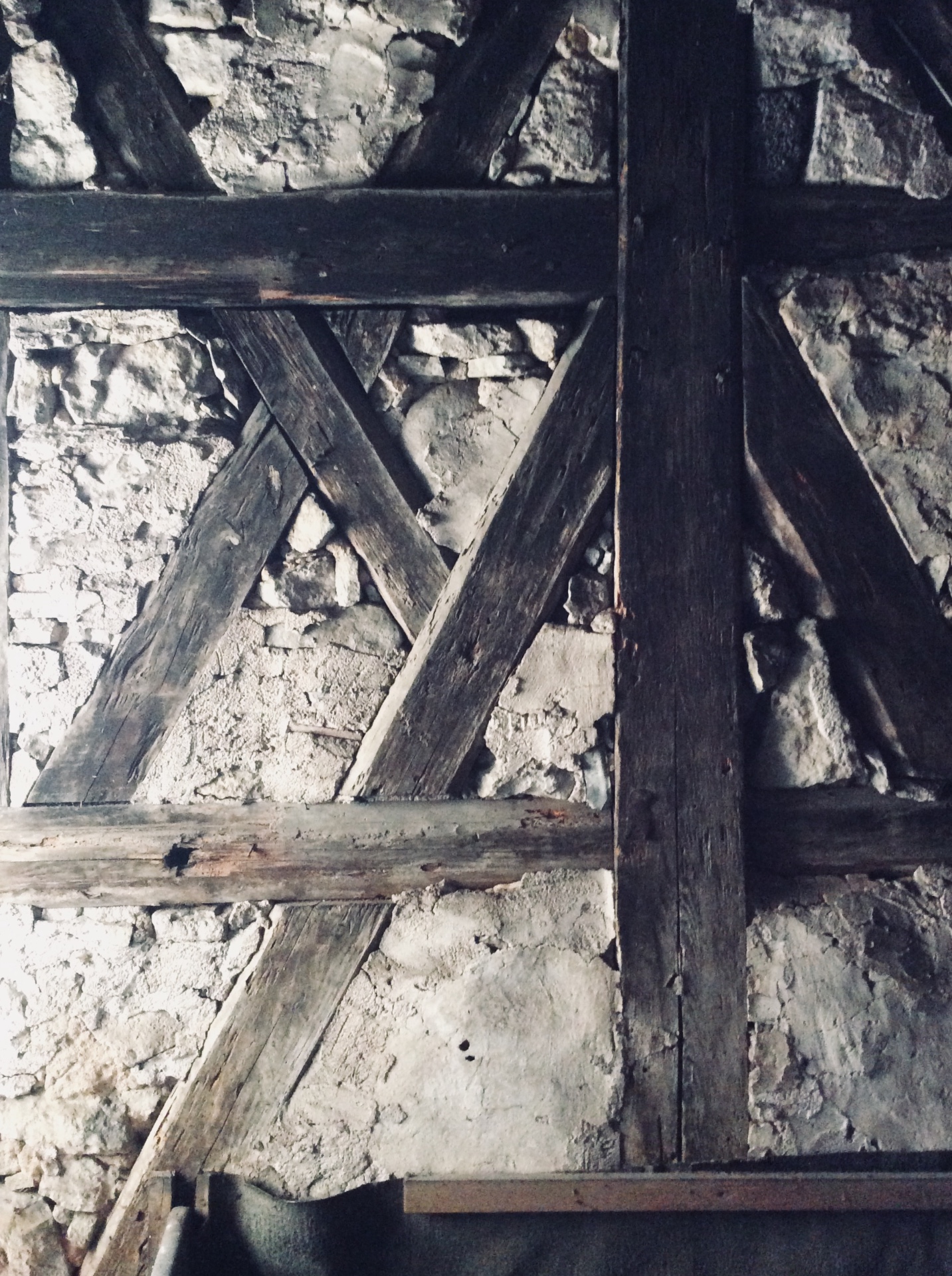 Exposed timber framing with stone and lime infill in the attic of Kronengasse 8